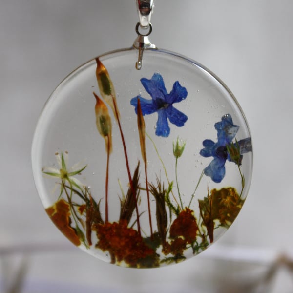 Transparent pendant with blue flowers and moss. Round Pendant . Pendant epoxy resin. Dry plants pendant