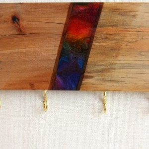 Wall-mounted key holder made of hard wood and decorated in the Petra Art technique, Rainbow decor, rainbow key holder