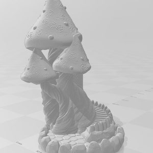 May include: A 3D printed model of a mushroom house with a stone base and a winding staircase. The house is made of three large mushrooms with white caps and brown stems.