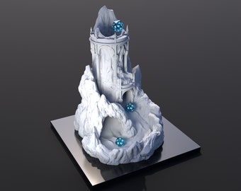 May include: A white 3D printed tower with a blue dice on top and two blue dice inside the tower. The tower is on a silver base.