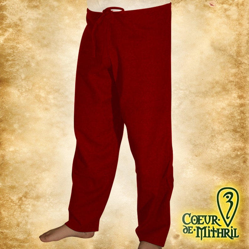 May include: Red linen pants with a drawstring waist. The pants are loose fitting and have a simple design.