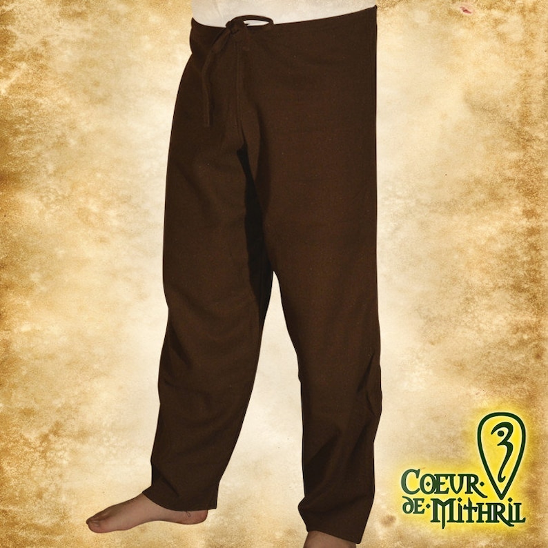 May include: Brown linen pants with a drawstring waist. The pants are loose fitting and have a simple design.