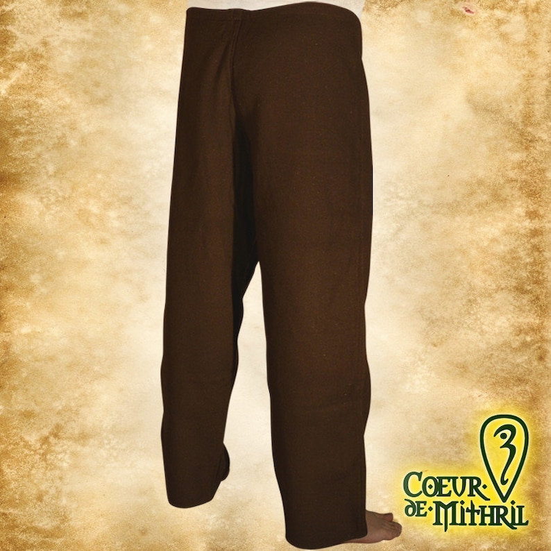 May include: Brown linen pants with a straight leg and a simple design. The pants are made of a soft, comfortable fabric and have a relaxed fit.