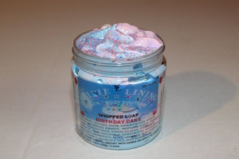May include: A blue and pink whipped soap in a jar with a label that reads "Whipped Soap Birthday Cake" and "Lillie Lining Bath Body Boutique".