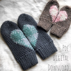 May include: Two pairs of crocheted mittens with heart designs. One pair is gray with a green and white heart, and the other pair is brown with a pink and white heart. The text "PDF DIGITAL DOWNLOAD" is visible in the image.