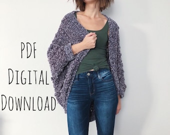 May include: A woman wearing a purple and white knit cardigan, a green tank top, and blue jeans with distressed knees. The text "PDF DIGITAL DOWNLOAD" is visible in the image.