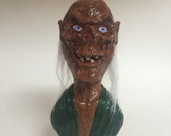 Cackling Curator - inspired by the Crypt Keeper from Tales from the Crypt