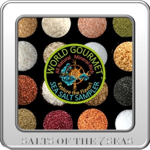 May include: A silver tin with a black background and 16 round containers filled with different types of sea salt. The tin has a green and yellow logo that says "World Gourmet All Natural Mineral-Rich Sea Salt Sampler Explore the Flavor!" and the text "Salts of the 7 Seas" at the bottom.