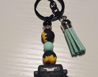 Off road vehicle & sunflower keychain