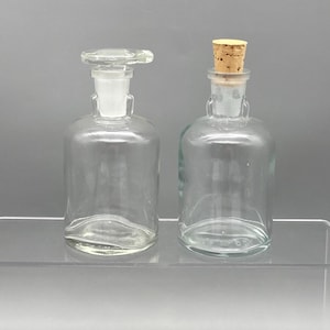 Vintage Pharmaceutical Apothecary Glass Bottles set of 2, T.C.W.CO circa 1938-70, 1 glass tabbed stopper, 1 cork stopper, No chips/cracks