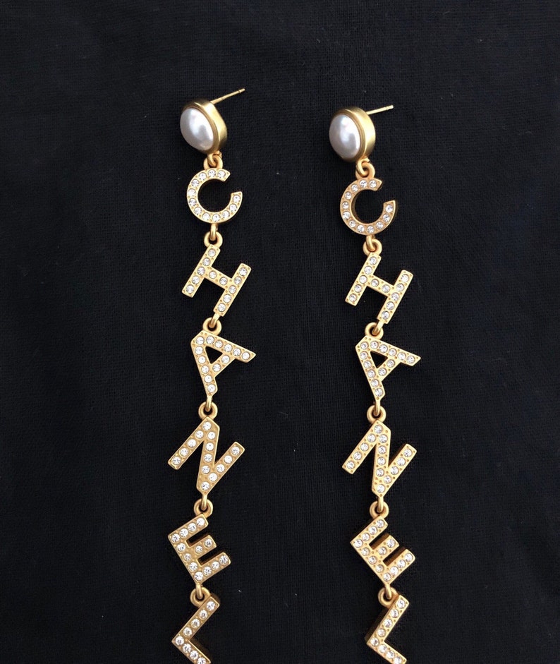Chanel letter long earrings Etsy
