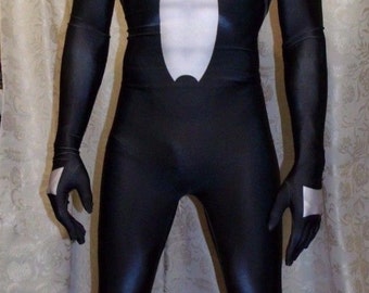 May include: A full-body black spandex bodysuit featuring a large white spider emblem on the chest, long sleeves with white accents on the hands, and a matching black mask with white mesh eye lenses that covers the entire head and face.