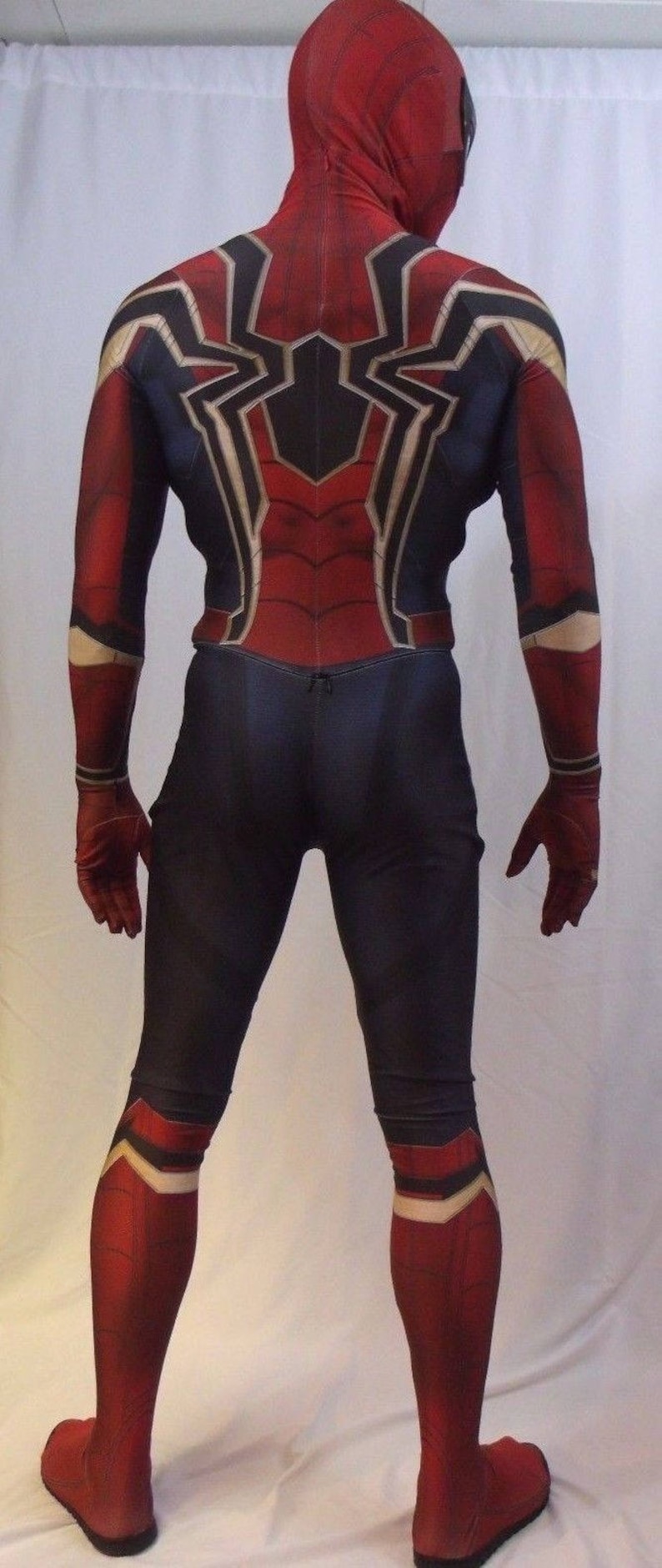 May include: A red and blue spandex costume with a spider design on the back. The costume has a hood and gloves.