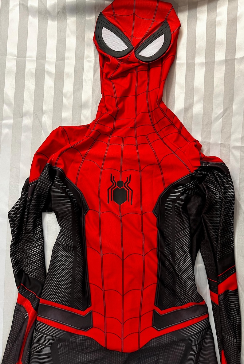 May include: Red and black Spider-Man costume with a black spider logo on the chest. The costume has a hood with a white eye mask.