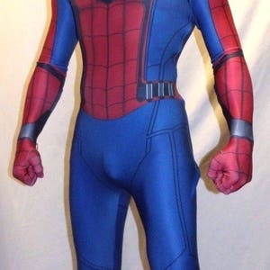 May include: A red and blue spandex costume of Spider-Man with a black spider logo on the chest. The costume has a red mask with black eyes and a web design.