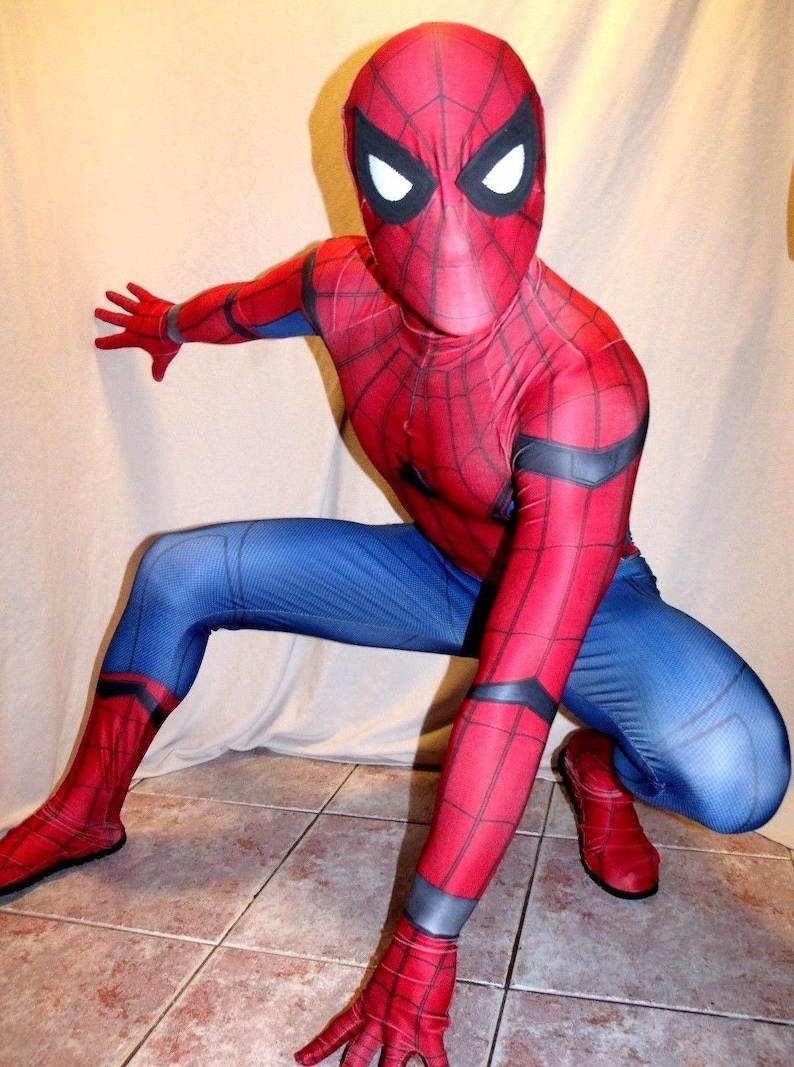 May include: A red and blue Spiderman costume with a black spider web design. The costume has a mask with white eyes.