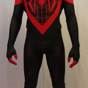 May include: A black and red spandex costume with a spider web design. The costume has a red spider symbol on the chest and red accents on the gloves and boots.