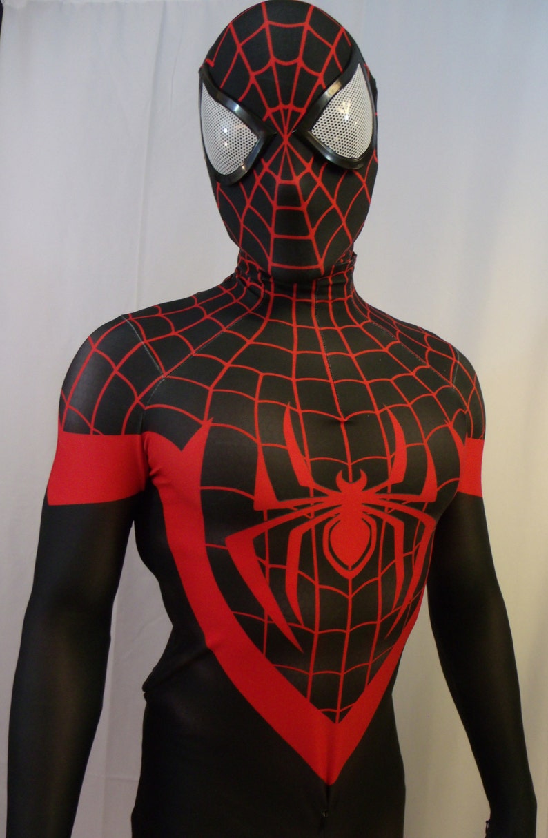 May include: A black and red spandex costume with a spider web design. The costume has a red spider symbol on the chest and a black mask with a red spider web design.