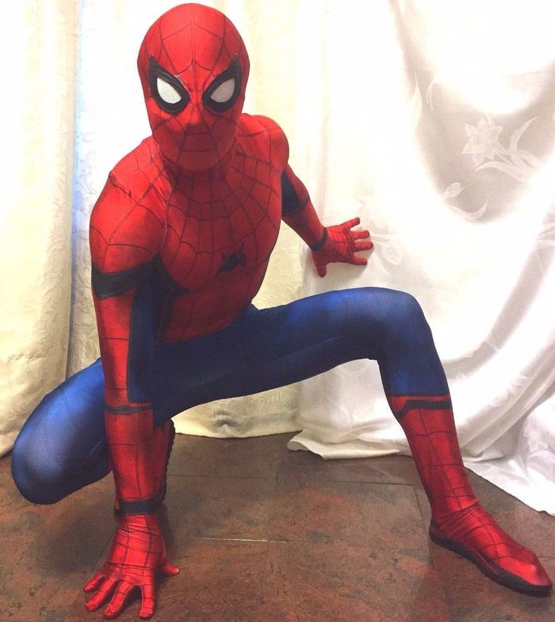 May include: A red and blue Spiderman costume with a mask. The costume has a spider web design on the chest and legs.