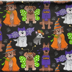 May include: Black fabric with a repeating pattern of dogs dressed in Halloween costumes. The dogs are wearing costumes such as a witch, a superhero, a butterfly, and a vampire. The fabric is perfect for crafting projects like bags, pillows, and quilts.