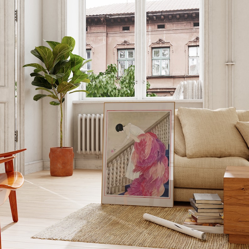 a living room with a picture of a woman on the wall