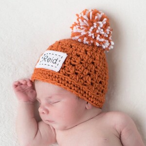 The hat color shown is pumpkin.