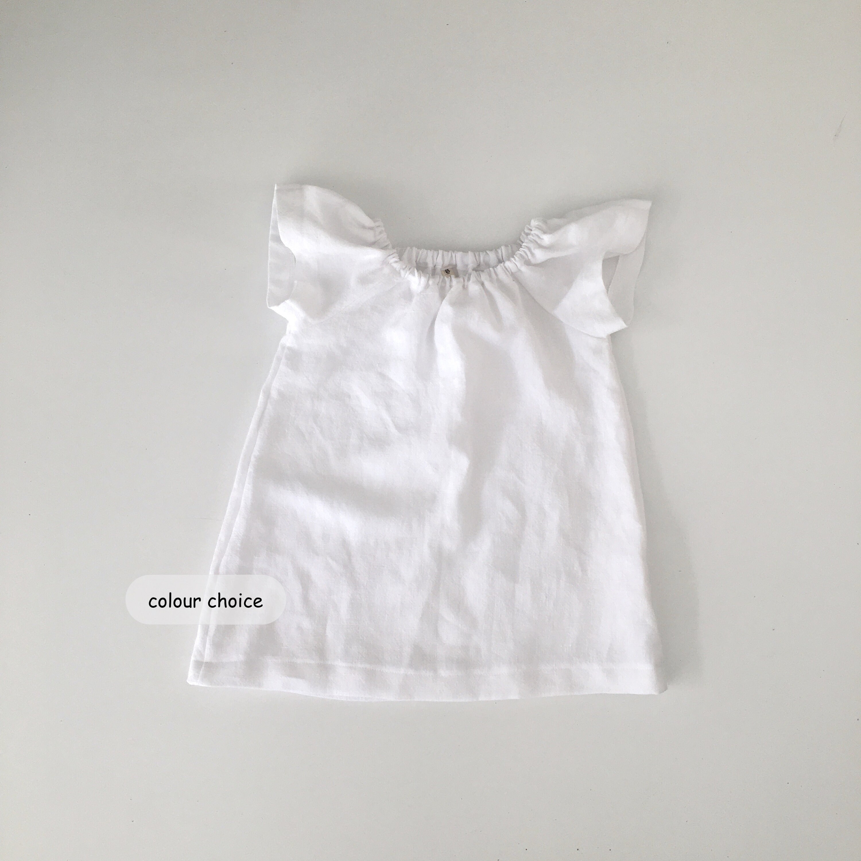 white linen baby dress