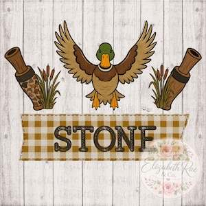 May include: A digital design featuring a cartoon duck with outstretched wings, two duck calls, and the name "STONE" on a plaid banner. The design includes cattails and is set against a white wood background.