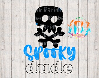 May include: Black skull and crossbones graphic with the words "Spooky Dude" in blue and black. A small blue star is on the skull. The background is a light wood grain.