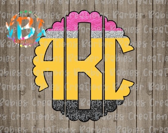 May include: A monogram design featuring the letters "ARC" in a yellow pencil-themed design. The pencil design includes pink, silver, and black sections, all within a scalloped border. The background is a wood grain pattern.