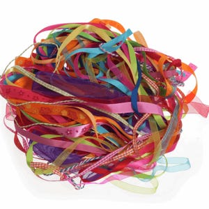 May include: A pile of colourful ribbons in various shades of pink, purple, blue, green, orange, and red. The ribbons are made of different materials, including satin, sheer, and patterned.