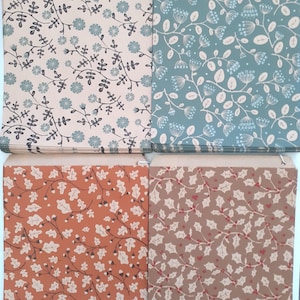 May include: Four paper envelopes with various botanical patterns. The top left envelope has a beige background with blue flowers and dark stems. The top right envelope has a teal background with white floral designs. The bottom two envelopes have orange and brown backgrounds.