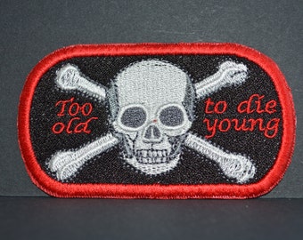 A machine embroidered hand finished cloth badge - too old to die young