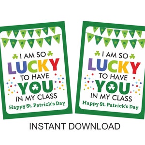 May include: Two printable signs with green borders and shamrock designs. The signs say "I am so lucky to have you in my class. Happy St. Patrick's Day."