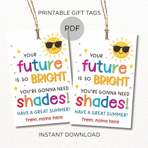 May include: Two printable gift tags with the text "Your future is so bright, you're gonna need shades!" The tags feature a smiling sun wearing sunglasses and colorful text. The tags are white with a string for hanging.