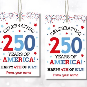 May include: Two white rectangular gift tags with a patriotic theme. The tags read "Celebrating 250 Years of America!" in red and blue, with fireworks and star accents. The tags also say "Happy 4th of July!"