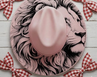 May include: A light pink fedora hat featuring a detailed black line art illustration of a lion's face and mane covering the brim. The hat is surrounded by four red and white gingham patterned bows, with the text PNG JPG SVG PDF INSTANT DOWNLOAD.