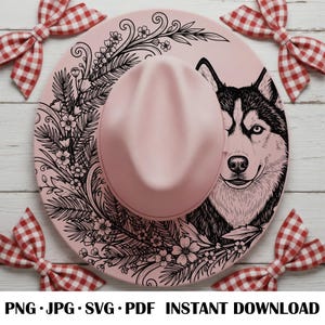 May include: A pink fedora-style hat with a black and white husky dog illustration on the brim. The hat features floral and leaf designs. The text "PNG • JPG • SVG • PDF • INSTANT DOWNLOAD" is at the bottom.