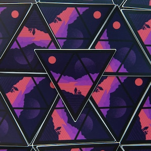 May include: A repeating pattern of triangular stickers with a dark purple background, a red sun, and a silhouette of a person standing on a purple and red landscape. The stickers are arranged in a staggered pattern.