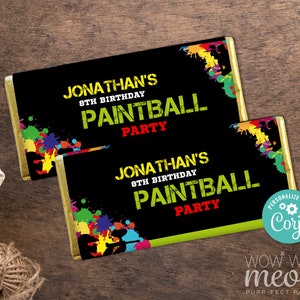 May include: Two black and green chocolate bar wrappers with a gold border. The wrappers have a colorful paint splatter design and the text "Jonathan's 8th Birthday Paintball Party".