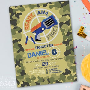 May include: A camouflage-patterned invitation for a birthday party. The invitation features a cartoon image of a toy gun with a target and the text "Ready, Aim, Fire!"  You've been targeted to join us! Daniel is turning 8. Join us for games, fun, food & cake. Sat 29 Oct. Join from 2pm til 4:30pm. 563 Main Road, South Street, CA 84756. RSVP to name on 576 6455342 or namesemail.com