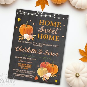 May include: A housewarming party invitation with a chalkboard design. The invitation features orange pumpkins, floral accents, and the text "Home Sweet Home." The invitation is for Charlotte & Jason, with the date, time, and address.