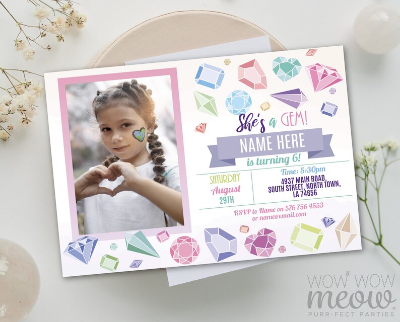 May include: A personalized birthday party invitation with a photo of a young girl making a heart shape with her hands. The invitation features colorful gem illustrations and the text "She's a GEM!" with space for the name and age.