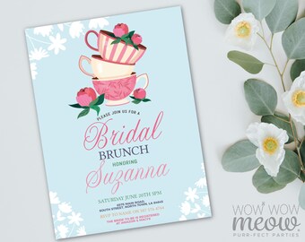 May include: A light blue bridal brunch invitation with floral and teacup illustrations. The invitation features stacked teacups, pink flowers, and the text "Bridal Brunch" and "Honoring Suzanna". The invitation also includes event details.