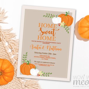 May include: A fall-themed invitation card with the words "Home Sweet Home" in orange script. The card features orange and white pumpkins, floral accents, and event details. The card is for a housewarming party honoring Anita & Nathan.