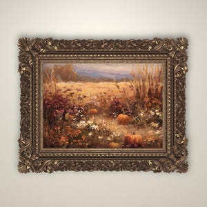 May include: An ornate, rectangular framed painting depicting a fall landscape. The artwork features a field of wheat, pumpkins, and wildflowers in shades of orange, yellow, and purple. The frame is a dark, ornate gold color.