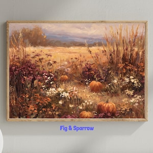 Könnte beinhalten: Gerahmtes Landschaftsgemälde, das ein Feld mit Weizen und Wildblumen in Orange-, Gelb- und Lilatönen zeigt. Mehrere orangefarbene Kürbisse sind über das Feld verstreut. Der Text "Fig & Sparrow" ist unten aufgedruckt.