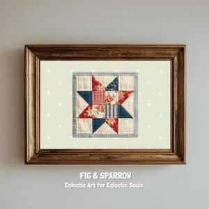 May include: A framed art piece featuring a star quilt block. The star is composed of red, blue, and floral patterned fabrics. The frame is a dark wood, and the background is a light cream color with a subtle floral pattern. Text at the bottom reads "FIG & SPARROW".