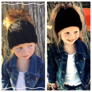 May include: Two young girls wearing black knit hats. One hat is a beanie style and the other is a headband style. Both girls are wearing denim jackets.