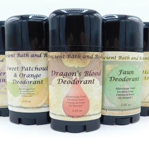 May include: Six natural deodorant sticks with various scents, including Lavender, Sweet Patchouli & Orange, Dragon's Blood, Faun, Honeysuckle, and Blackberry. Each stick is 2.35 ounces and is labeled "Aluminum Free! Paraben Free! Chemical Free! All Natural!"